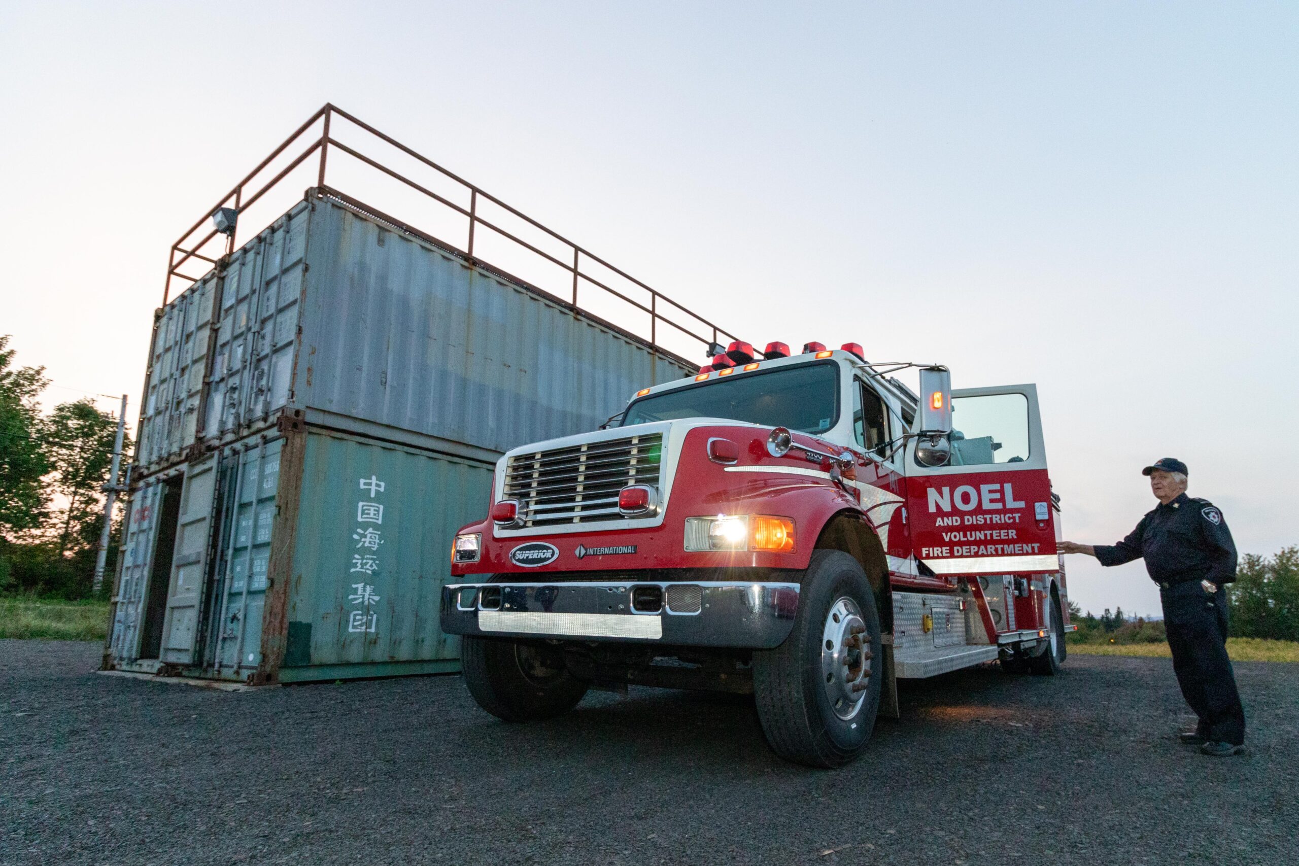 red fire truck next to containers used for training